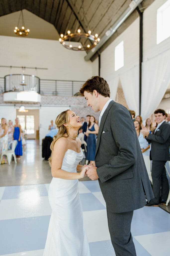 Bride and groom sharing their first dance during their wedding reception