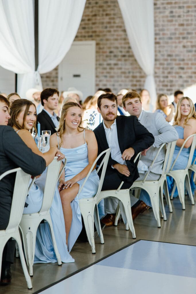 Wedding guests reacting to the bride and groom's first dance