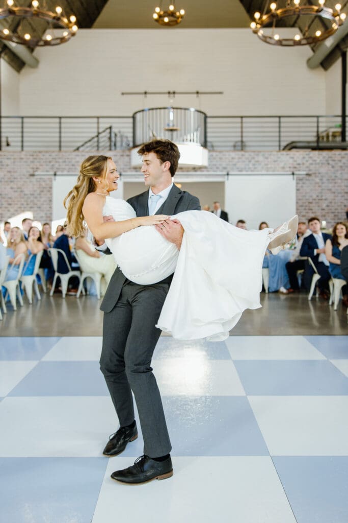 Bride and groom sharing their first dance during their wedding reception