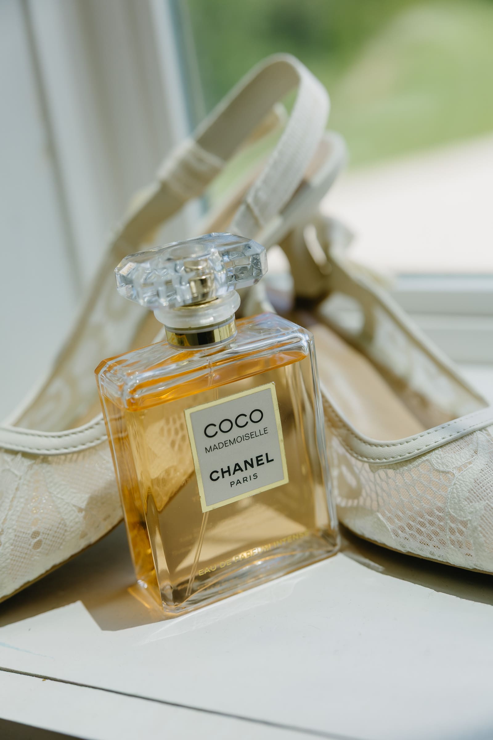 Chanel perfume and bridal shoes photographed while the bride got ready