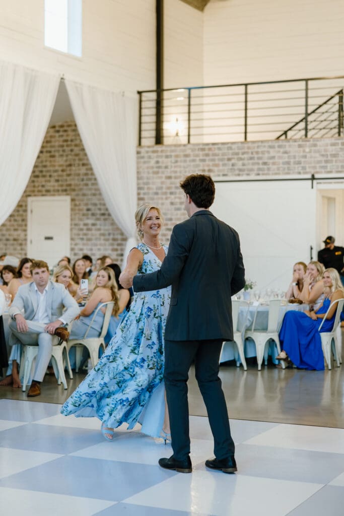 Groom dancing with his mom during the wedding reception