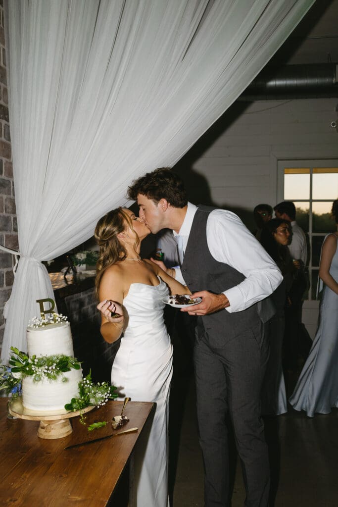 Newlyweds cutting their wedding cake during the reception