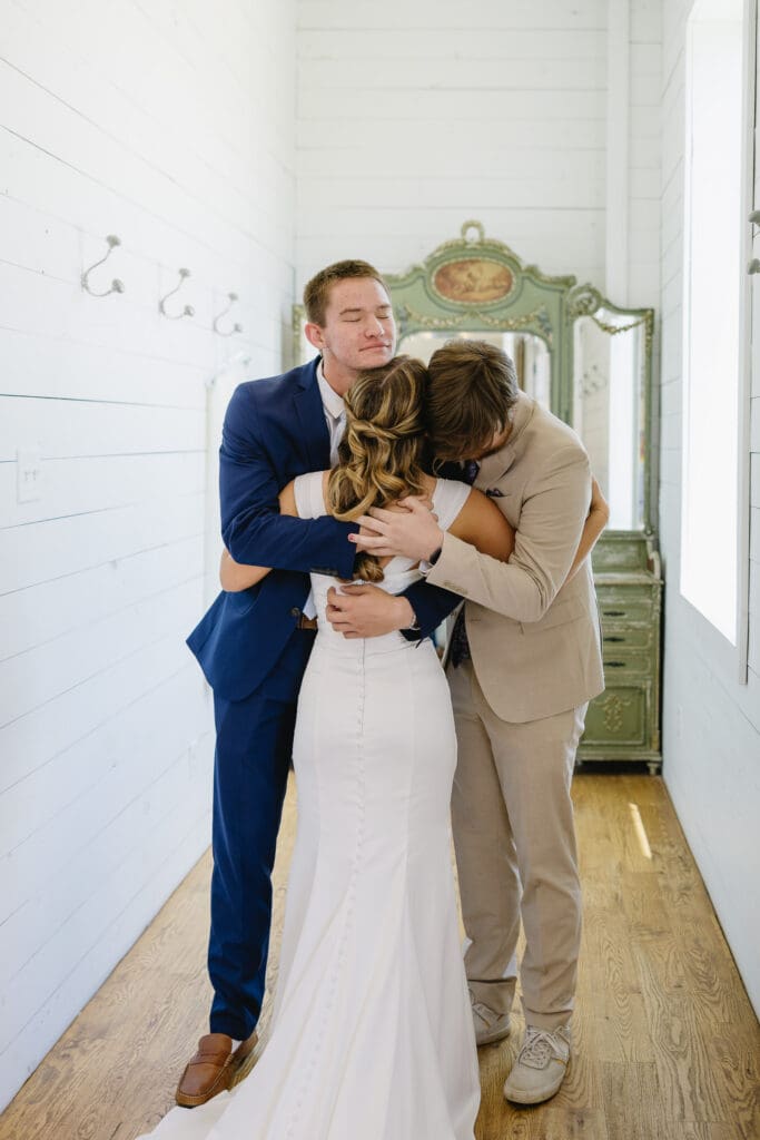 Bride sharing an emotional moment with family before the wedding ceremony