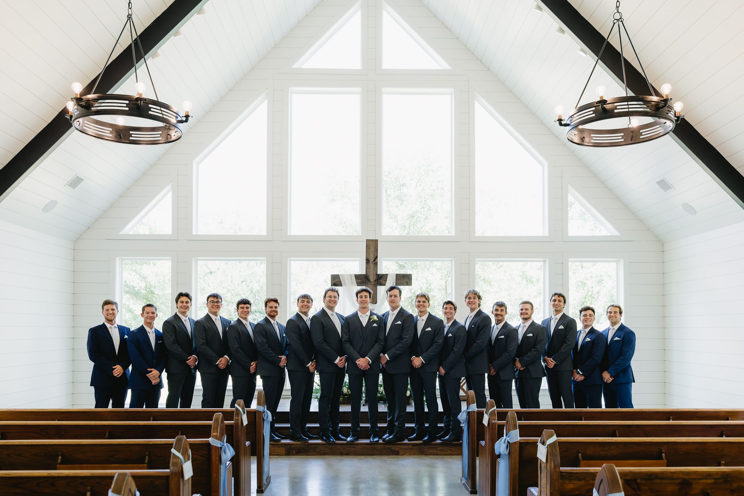 Groom with his groomsmen inside the chapel at The Barn at Paradise Place