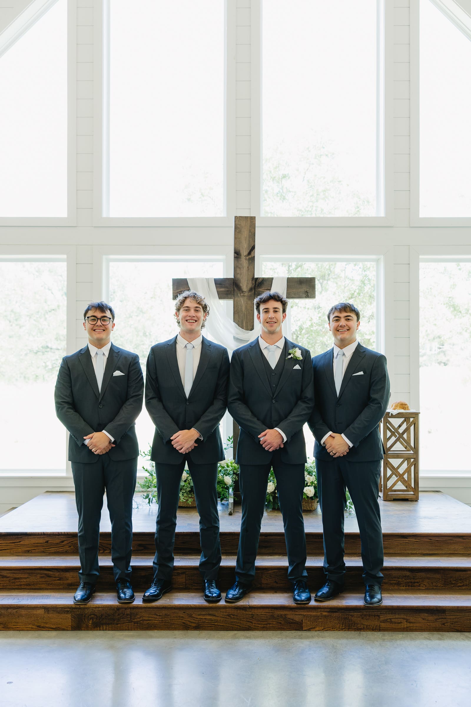 Groom with a group of his groomsmen before the wedding ceremony