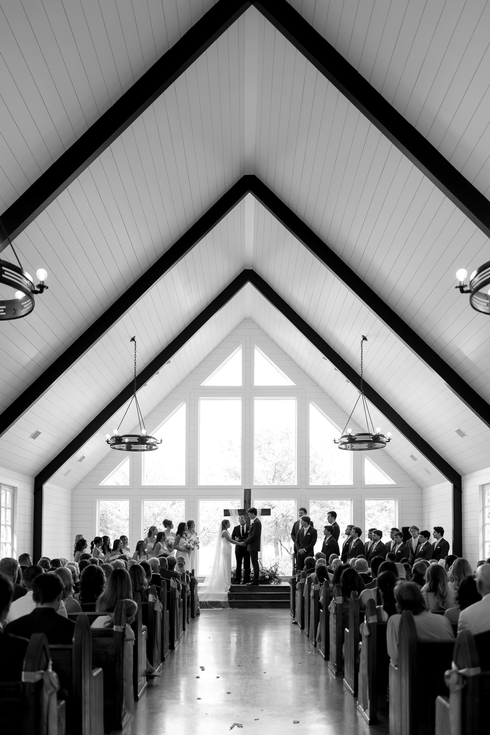 Light-filled wedding ceremony inside The Barn at Paradise Place chapel