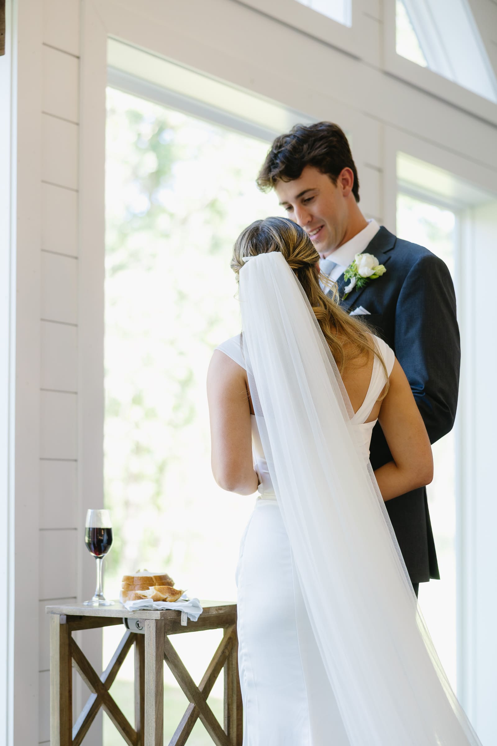 Bride and groom sharing a quiet moment during their wedding ceremony