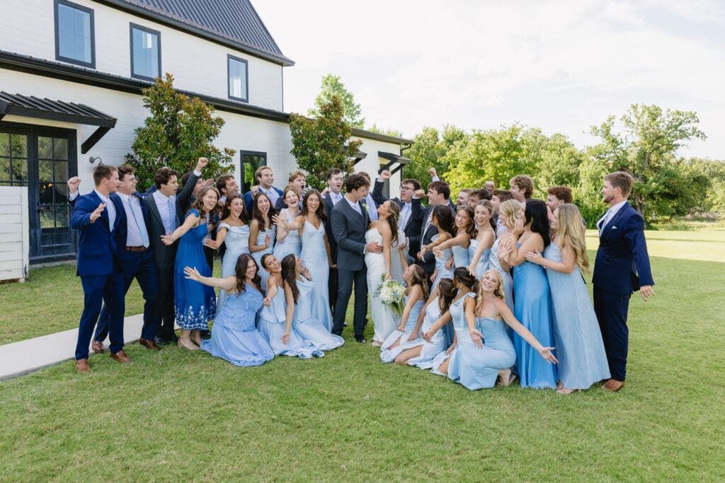 Bride and groom celebrating with their wedding party after the ceremony